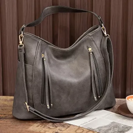 Beth Cross Body with tasseled front zippers